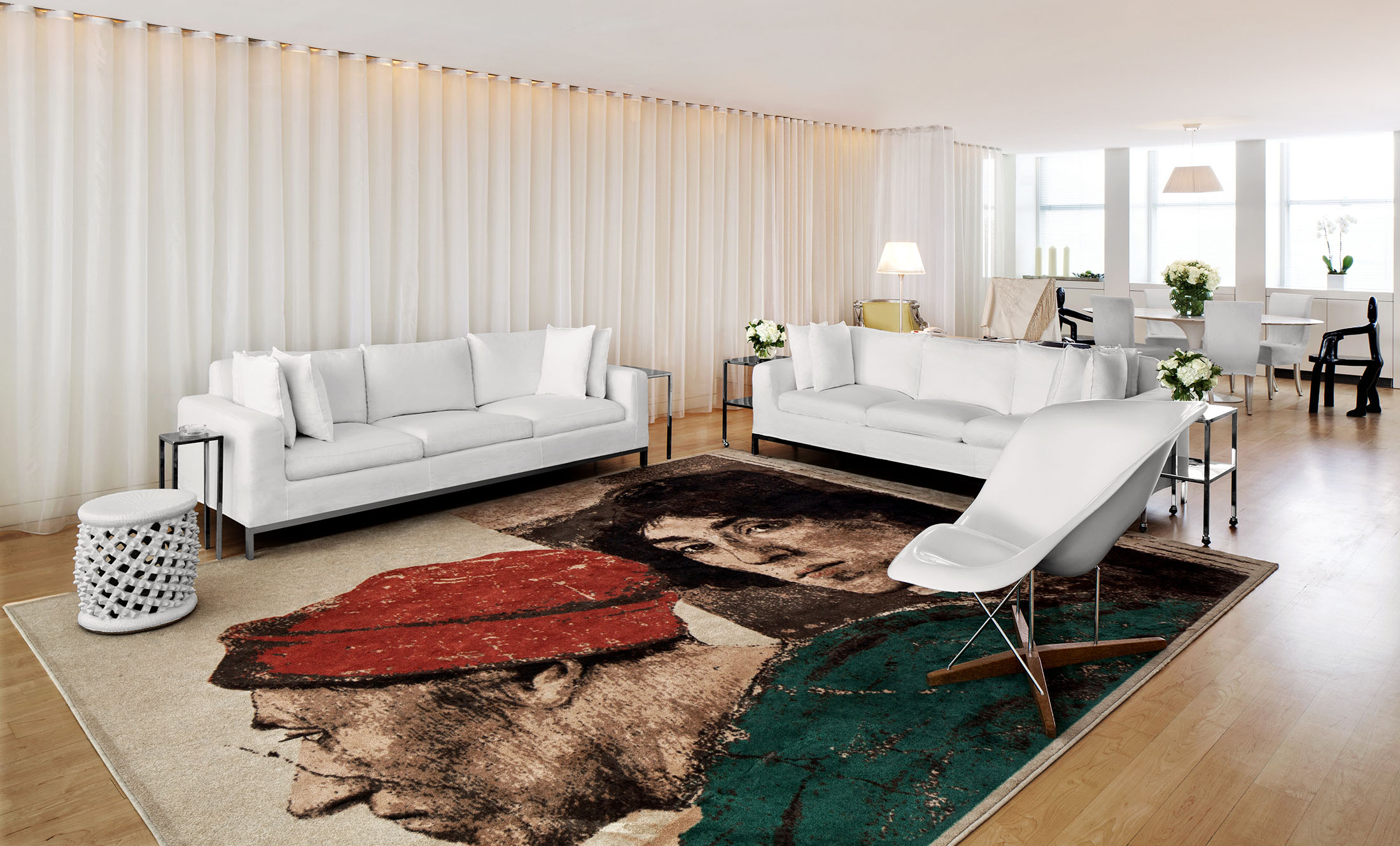 penthouse suite hotel room living area with white couches