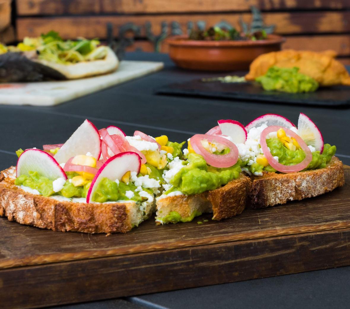 avocado toast on a wooden serving board