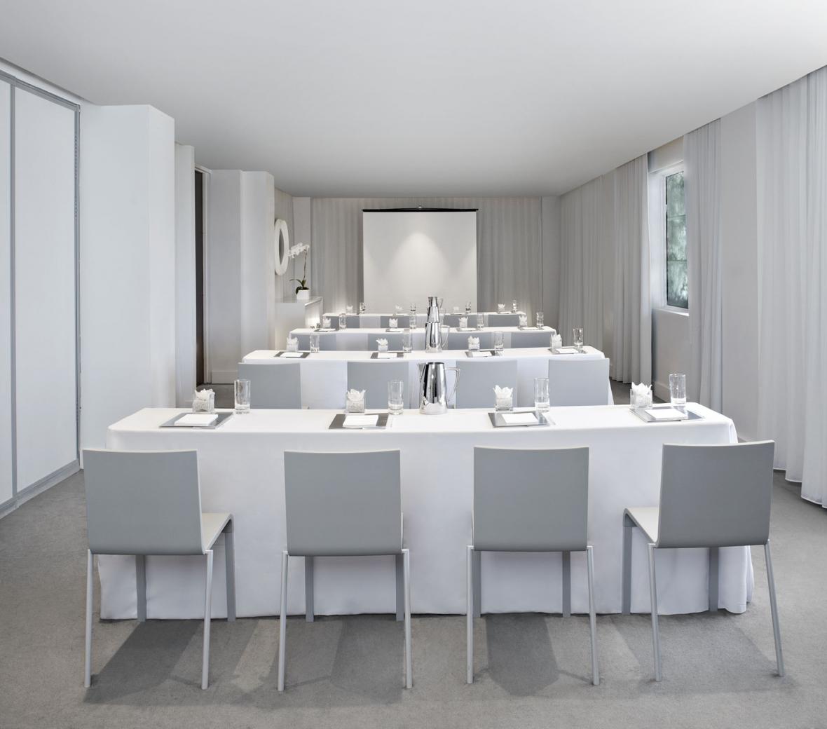 White room set up for a classroom style meeting
