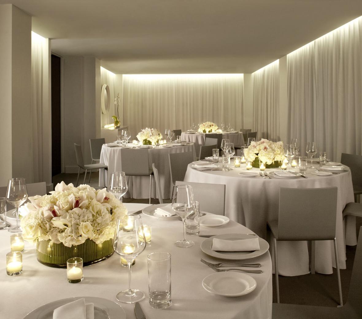 Elegant white tables set up for an event