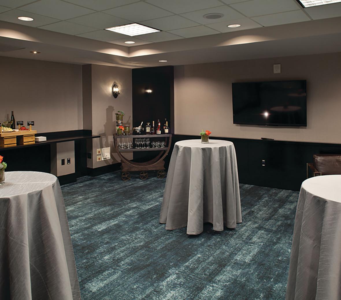 Cocktail-style tables in a meeting room