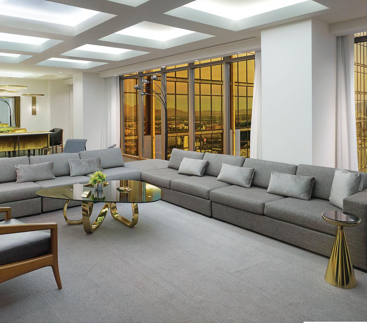 Grey sofas in large living room with view of Las Vegas strip