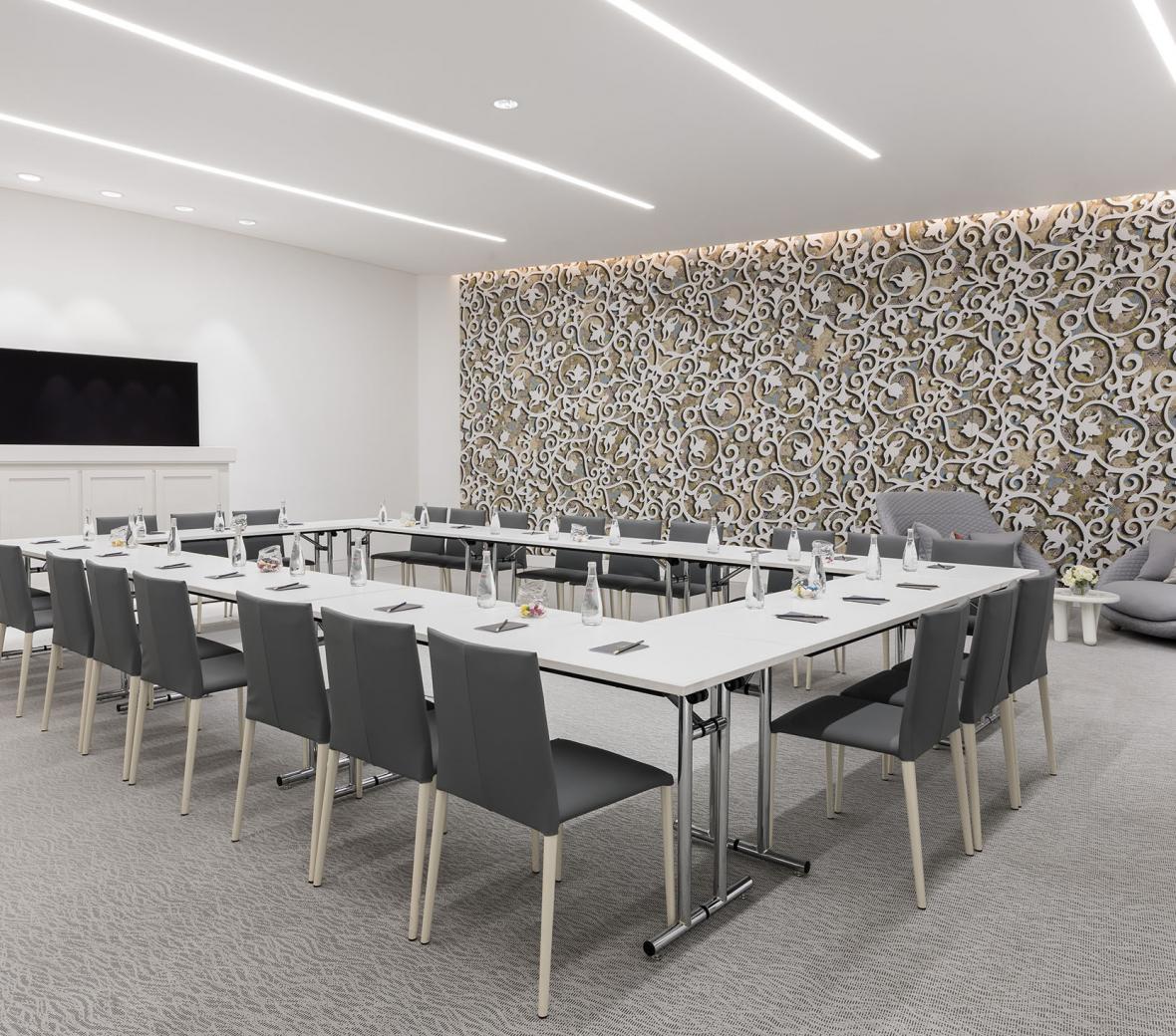 Meeting room set up with tables in a square formation