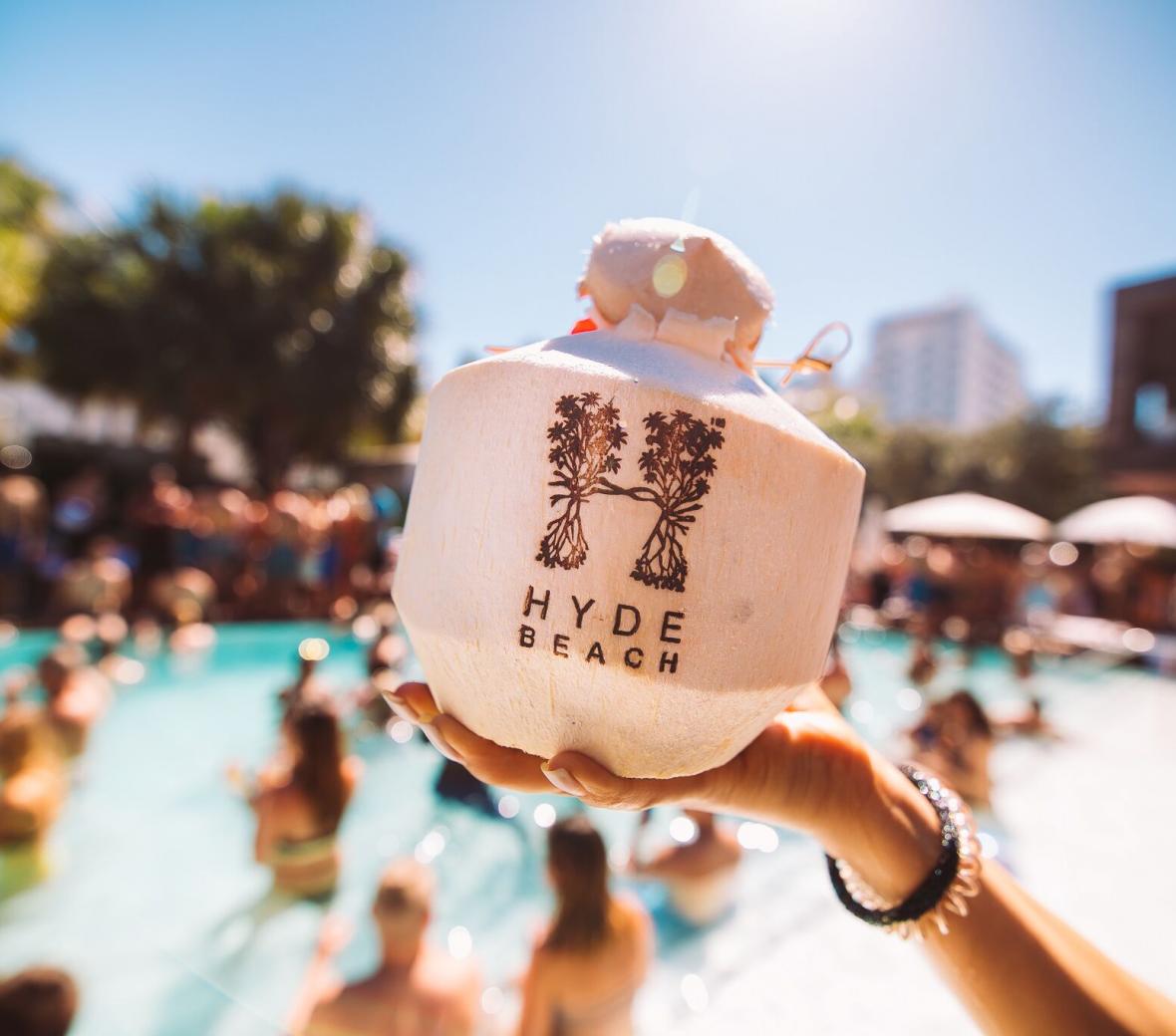 hand holding a coconut drink