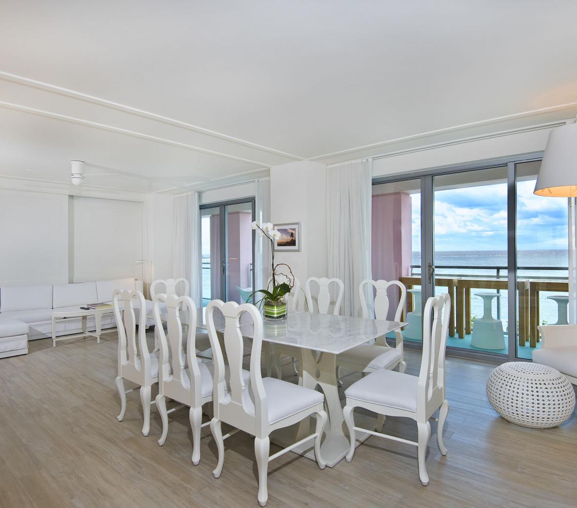 dining room with white chairs and table