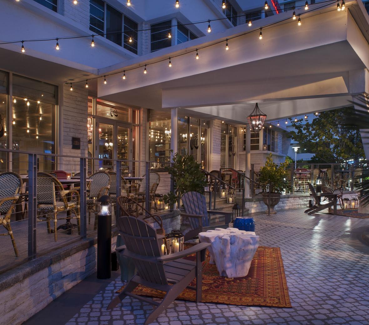 hotel patio with chairs at night 