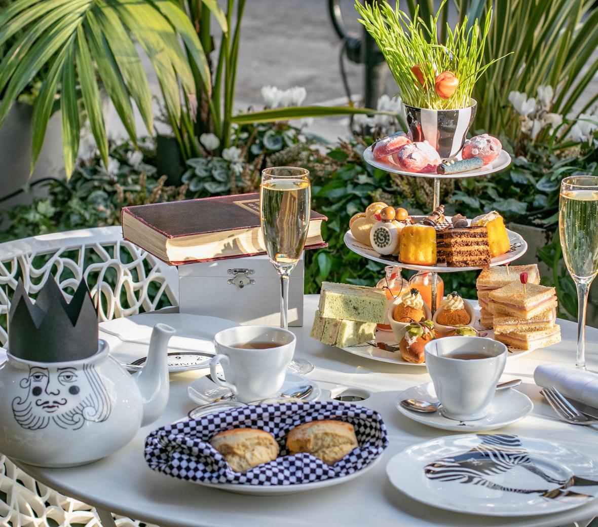 afternoon tea setup with champagne and scones