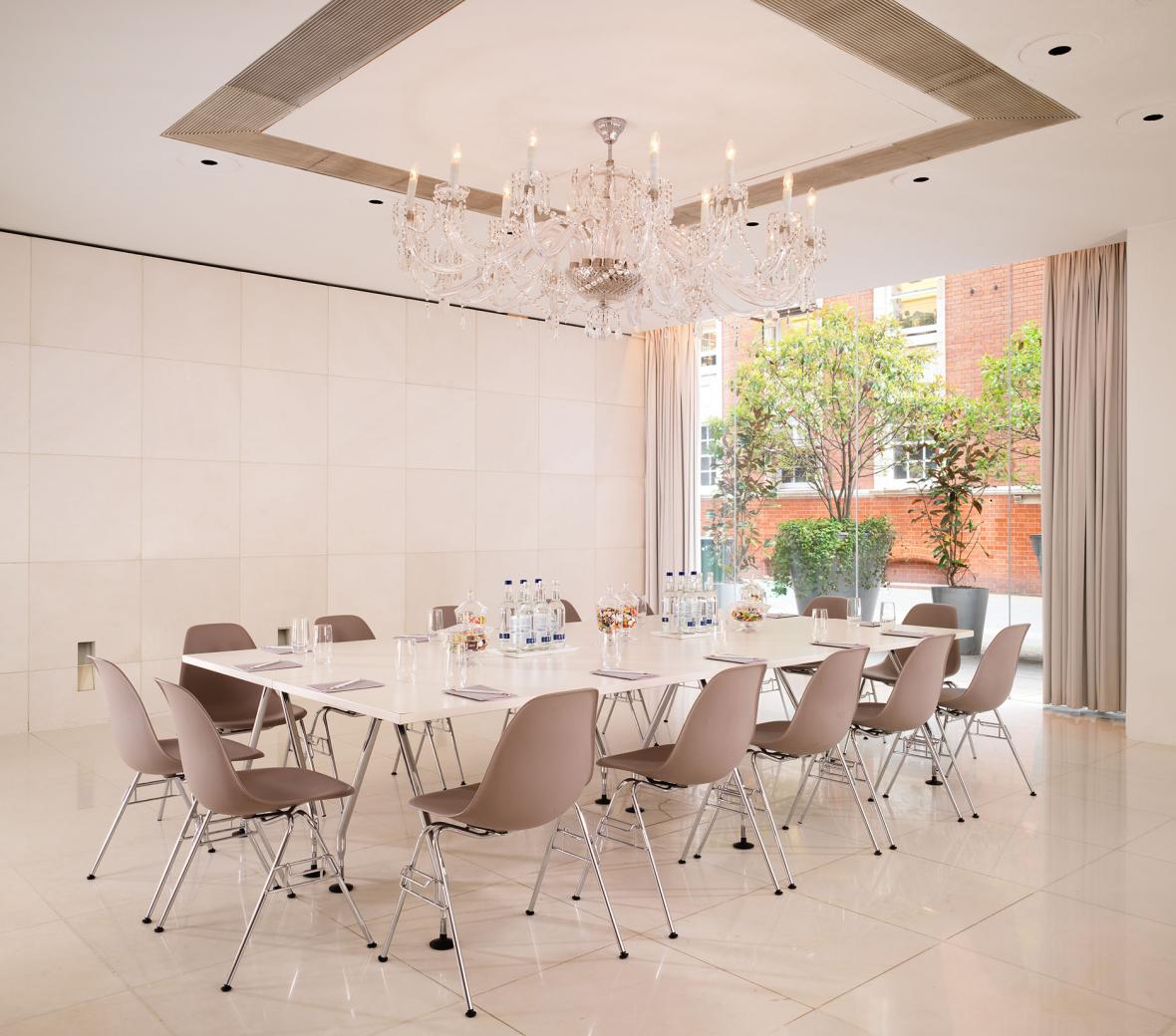 meeting room with large window and boardroom table