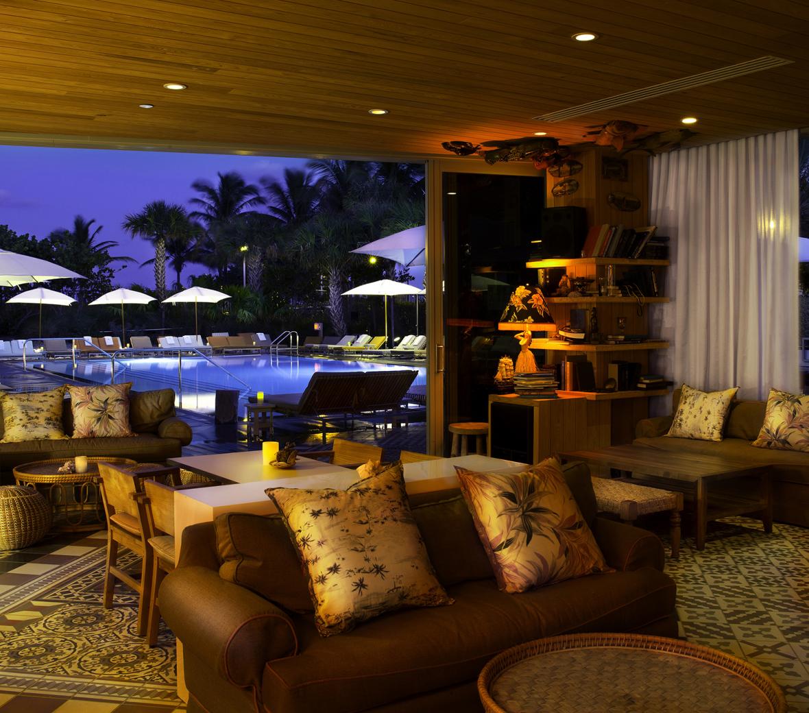 Hyde Beach outdoor pool lounge area at night