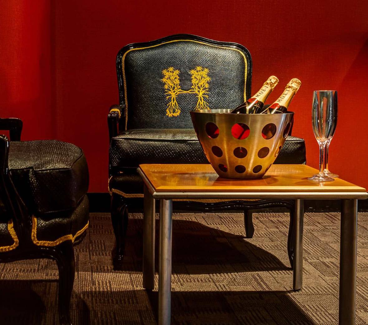 Hyde American Airlines chairs with champagne