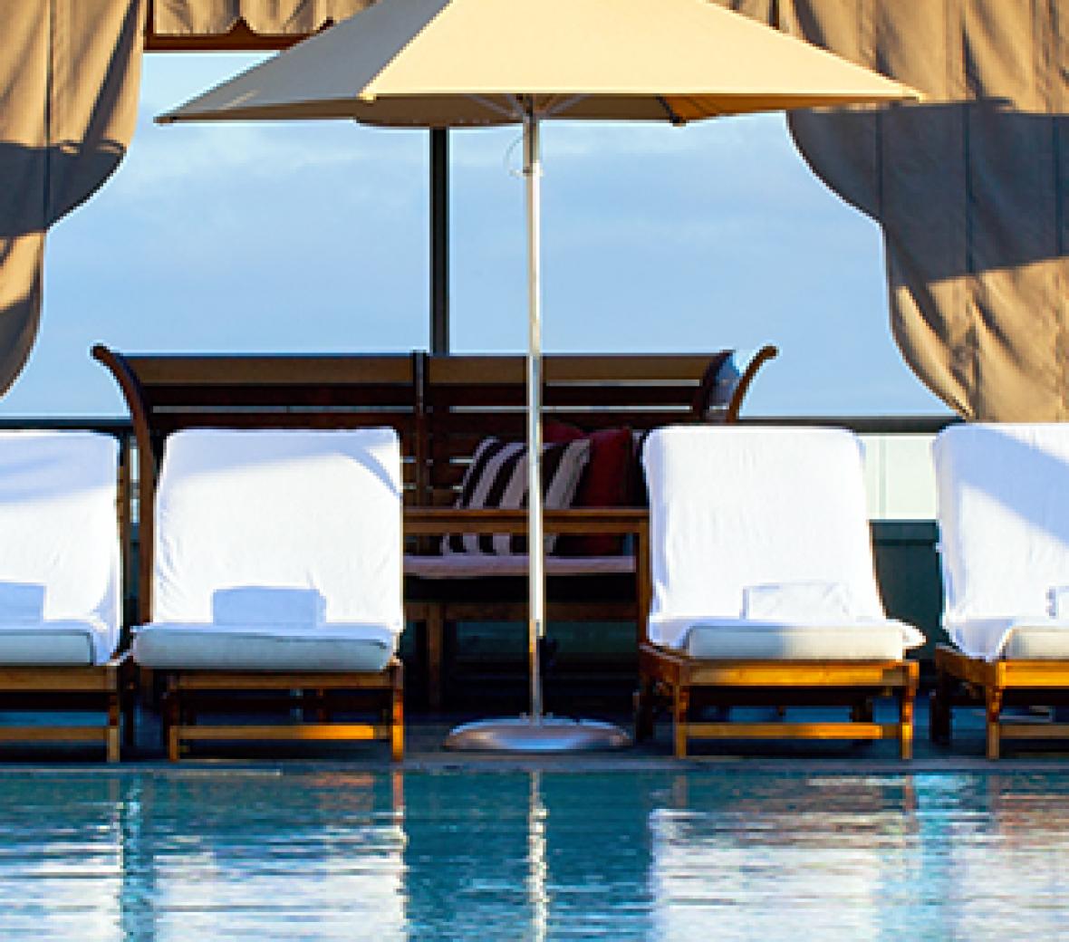 Cabanas surrounding a tropical pool