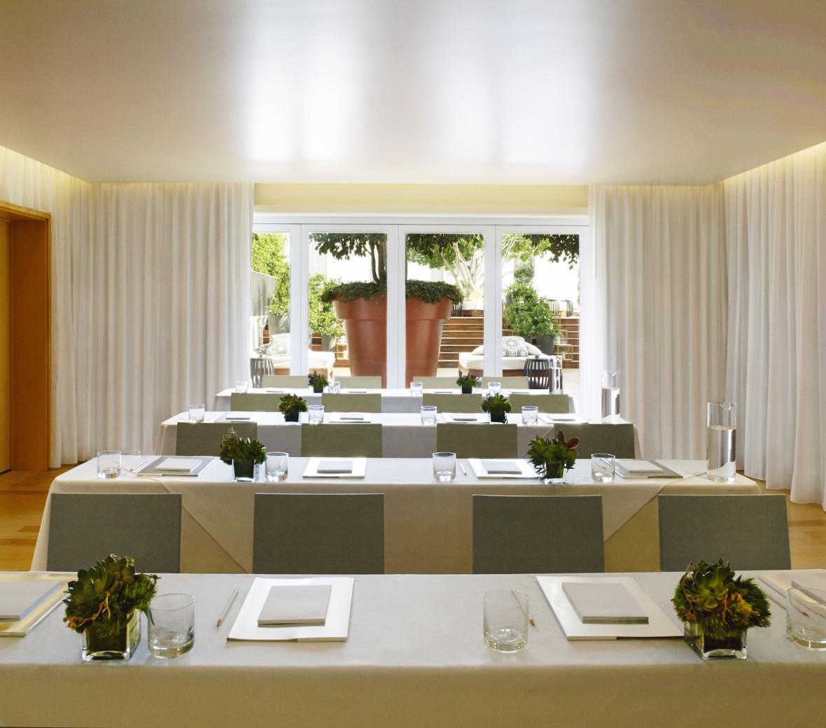 meeting-tables-flowers-patio-view