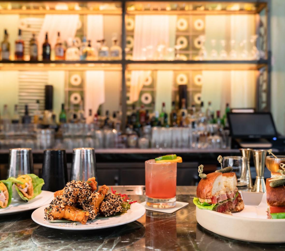 happy hour spread with food and cocktails