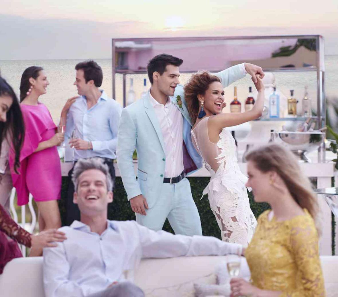 wedding party with sunset and ocean background