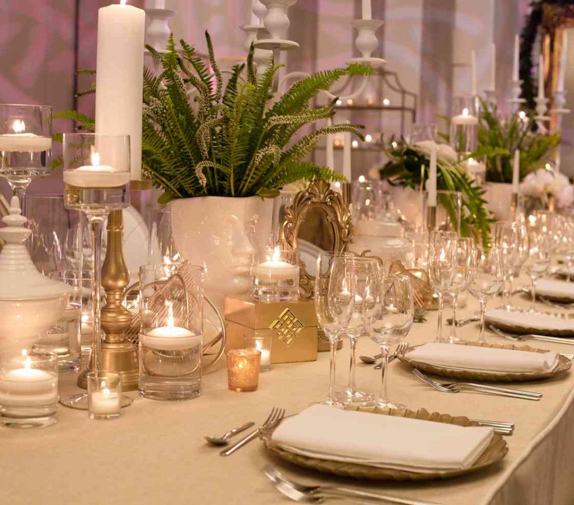 wedding table with decorative glassware and plants
