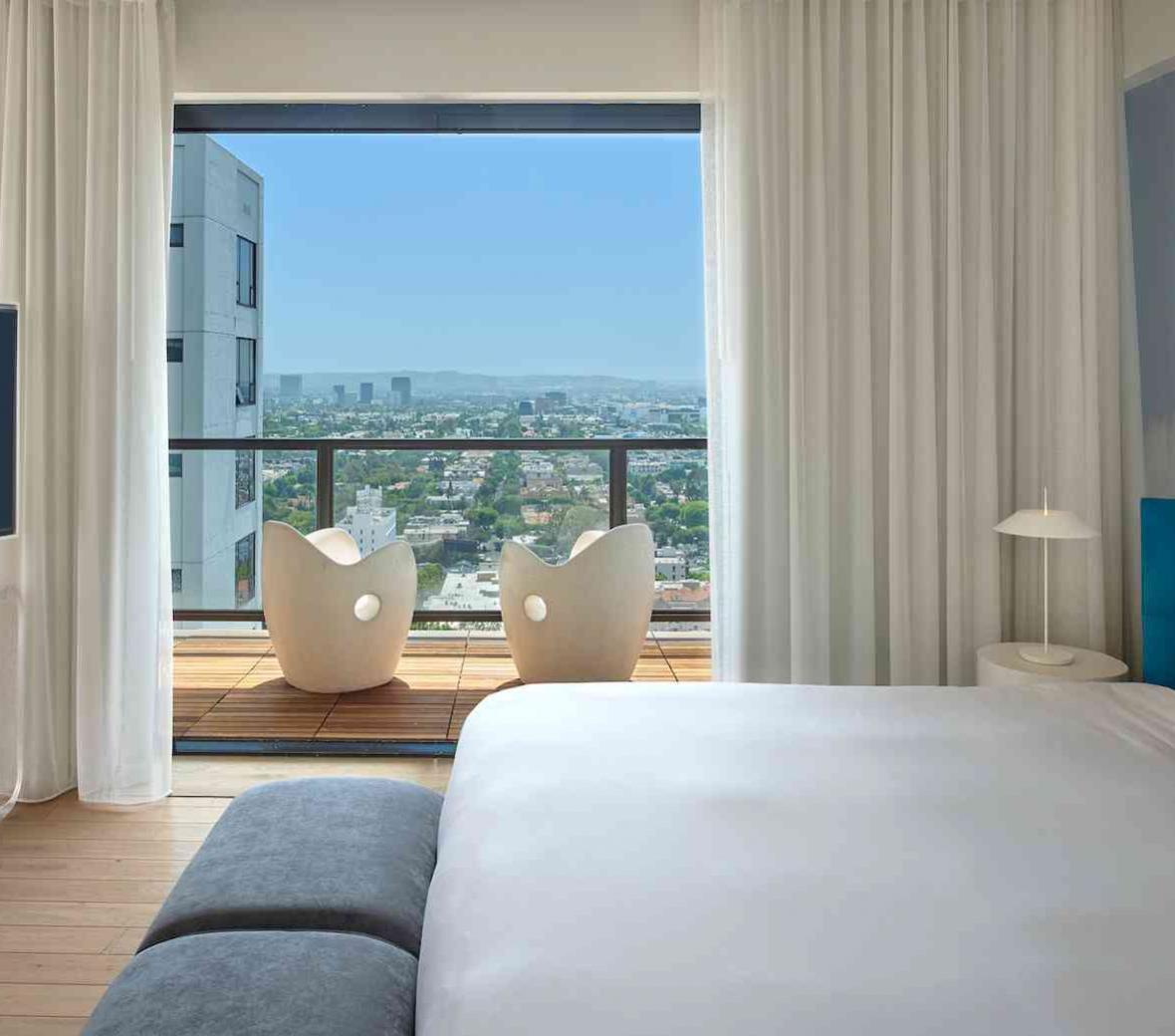 view of balcony across bed