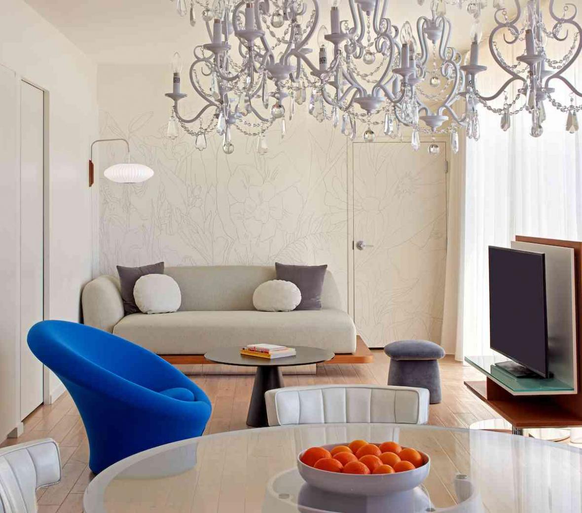 living room with couches tv and glass table