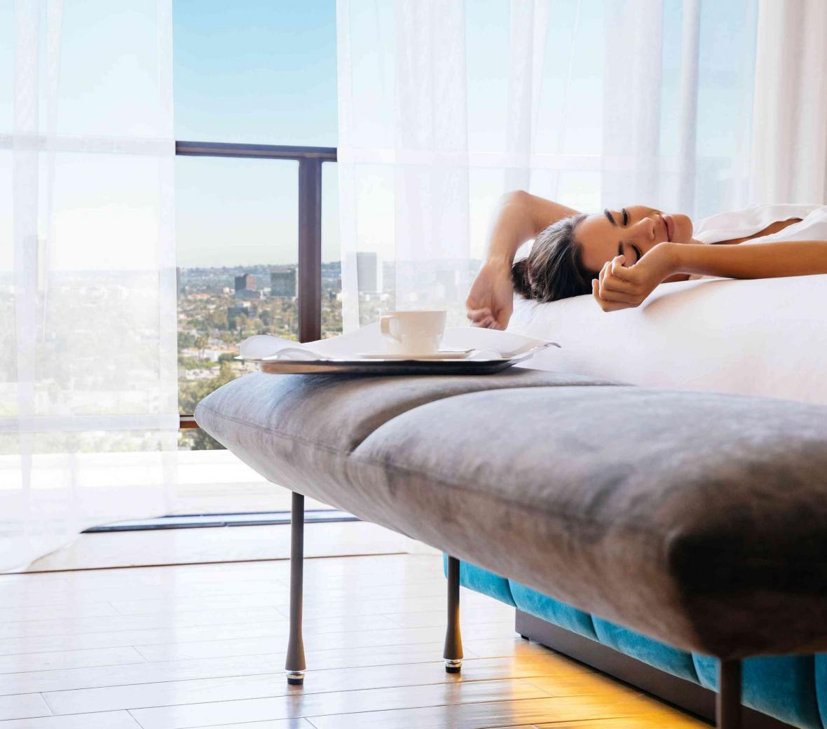 woman on a hotel bed