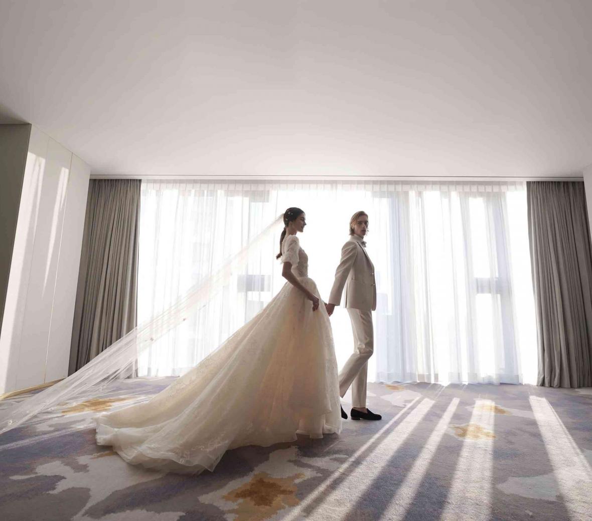 a bride and groom in a wedding venue