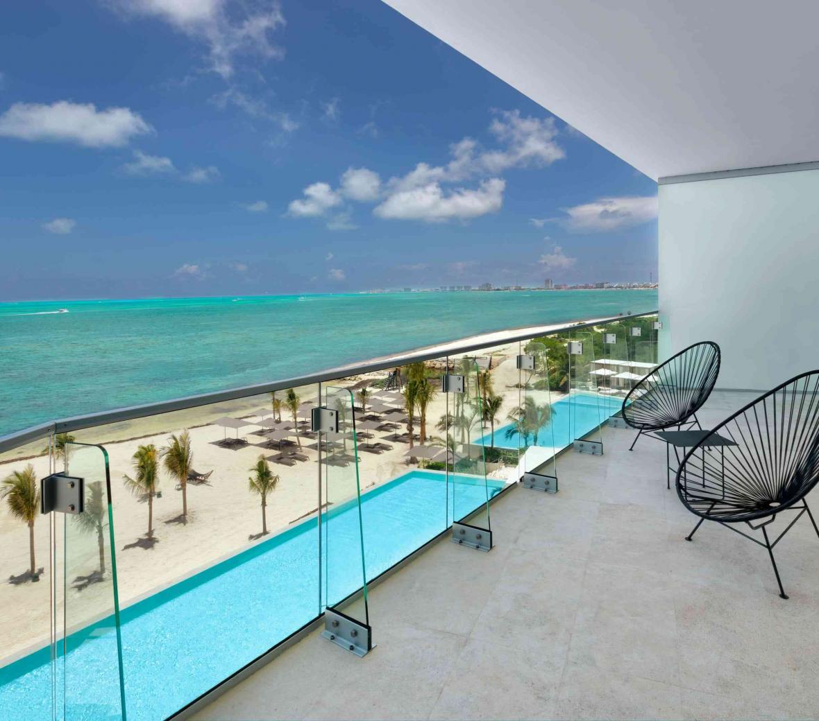 Balcony overlooking the pool and beach