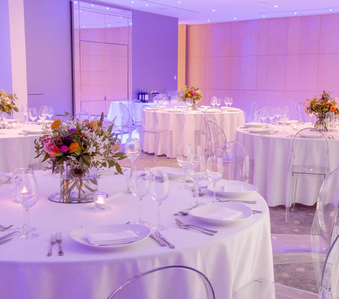Dinner tables set up in a meeting room