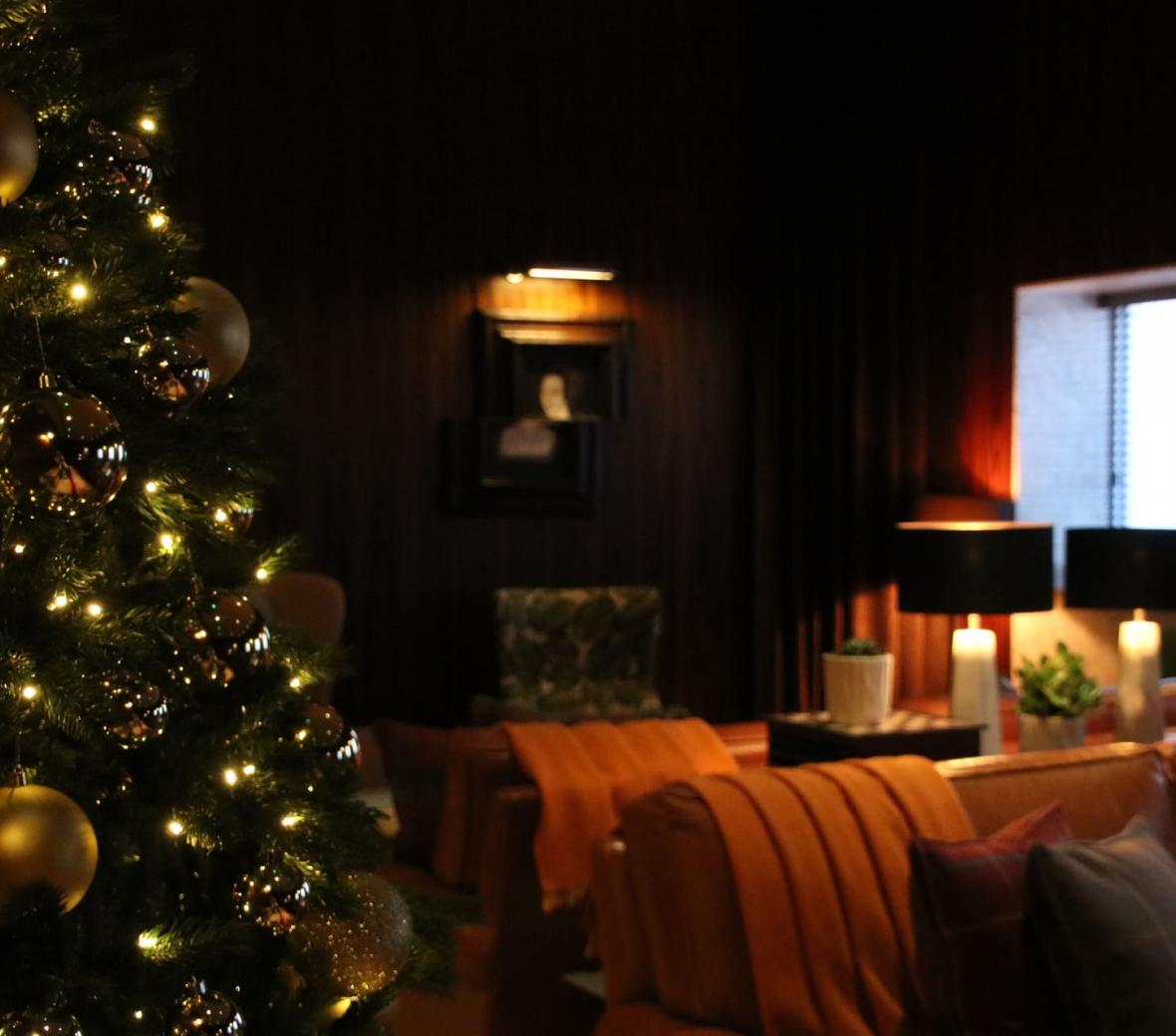 The Den lounge with a Christmas tree