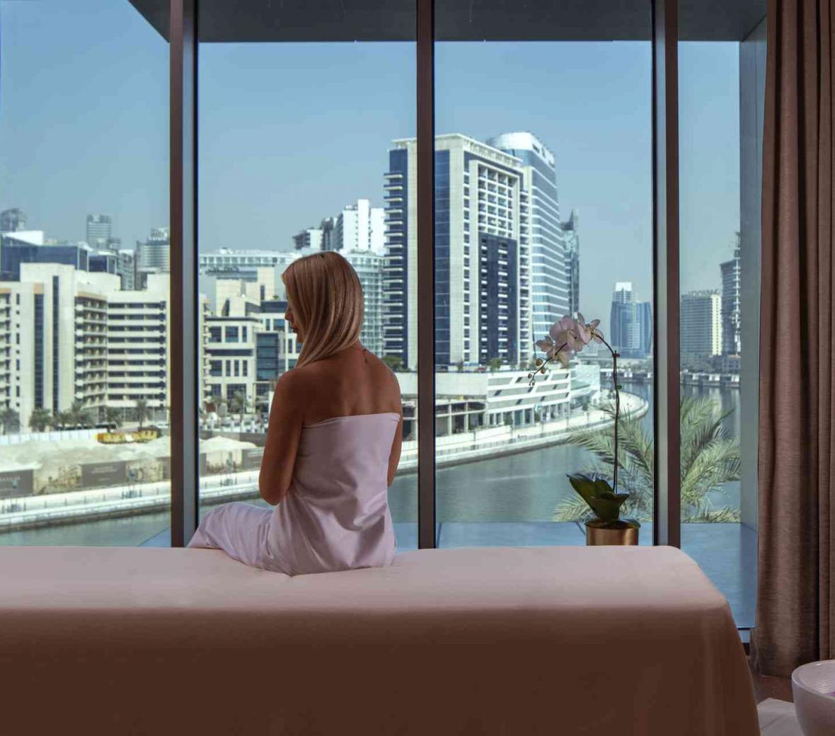 woman sitting on massage table