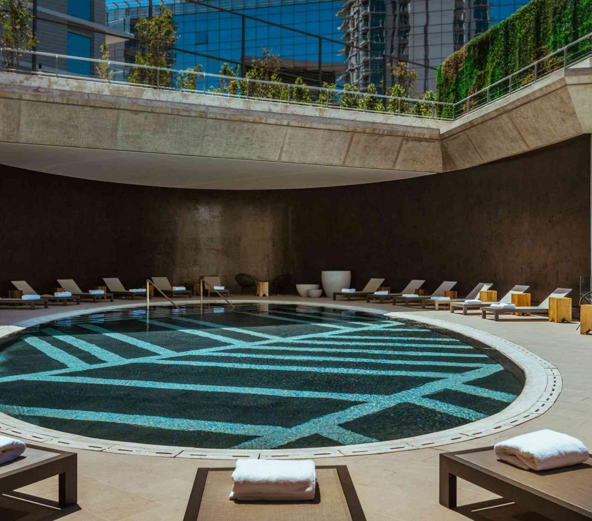 pool area surrounded by lounge chairs