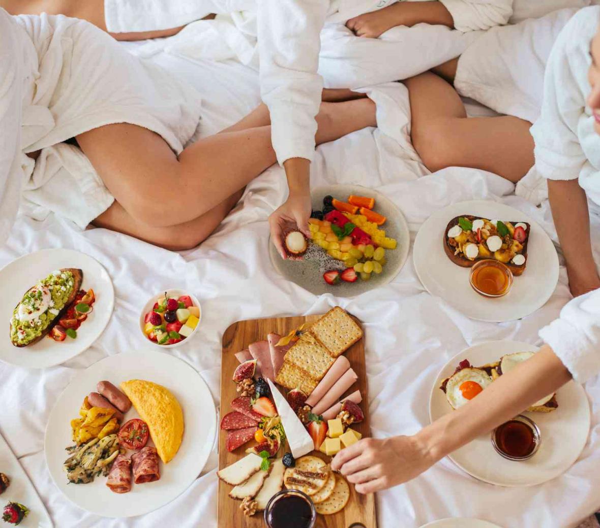 Friends having breakfast at the hotel room