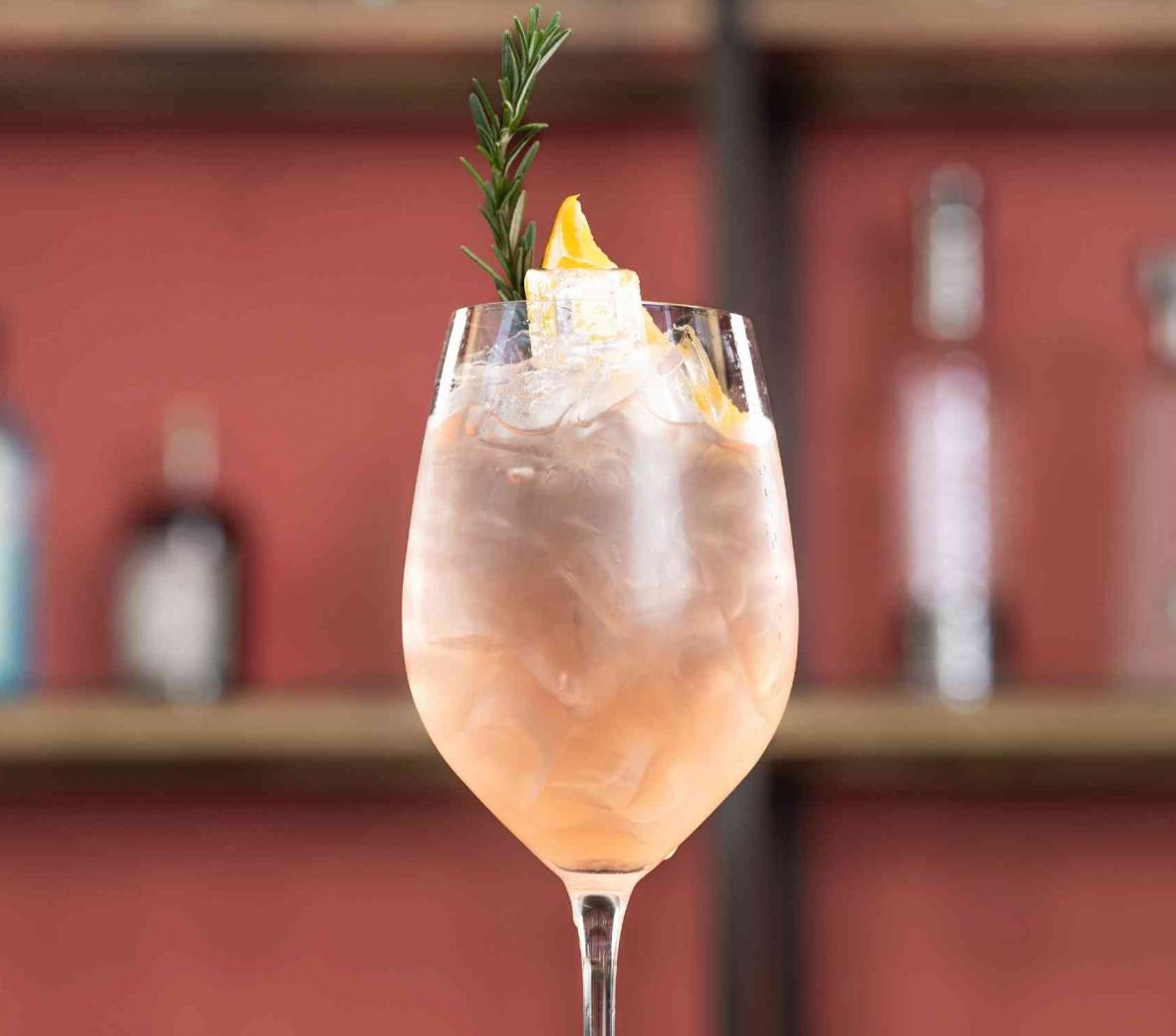 Pink cocktail in a wine glass