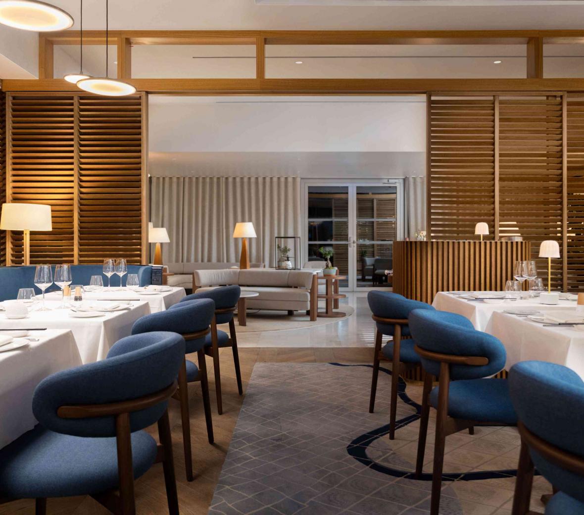 Tabes set for dinner with white linens at Mr. Nakamoto restaurant