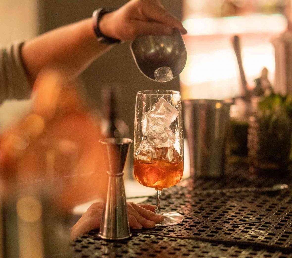 A cocktail being poured 