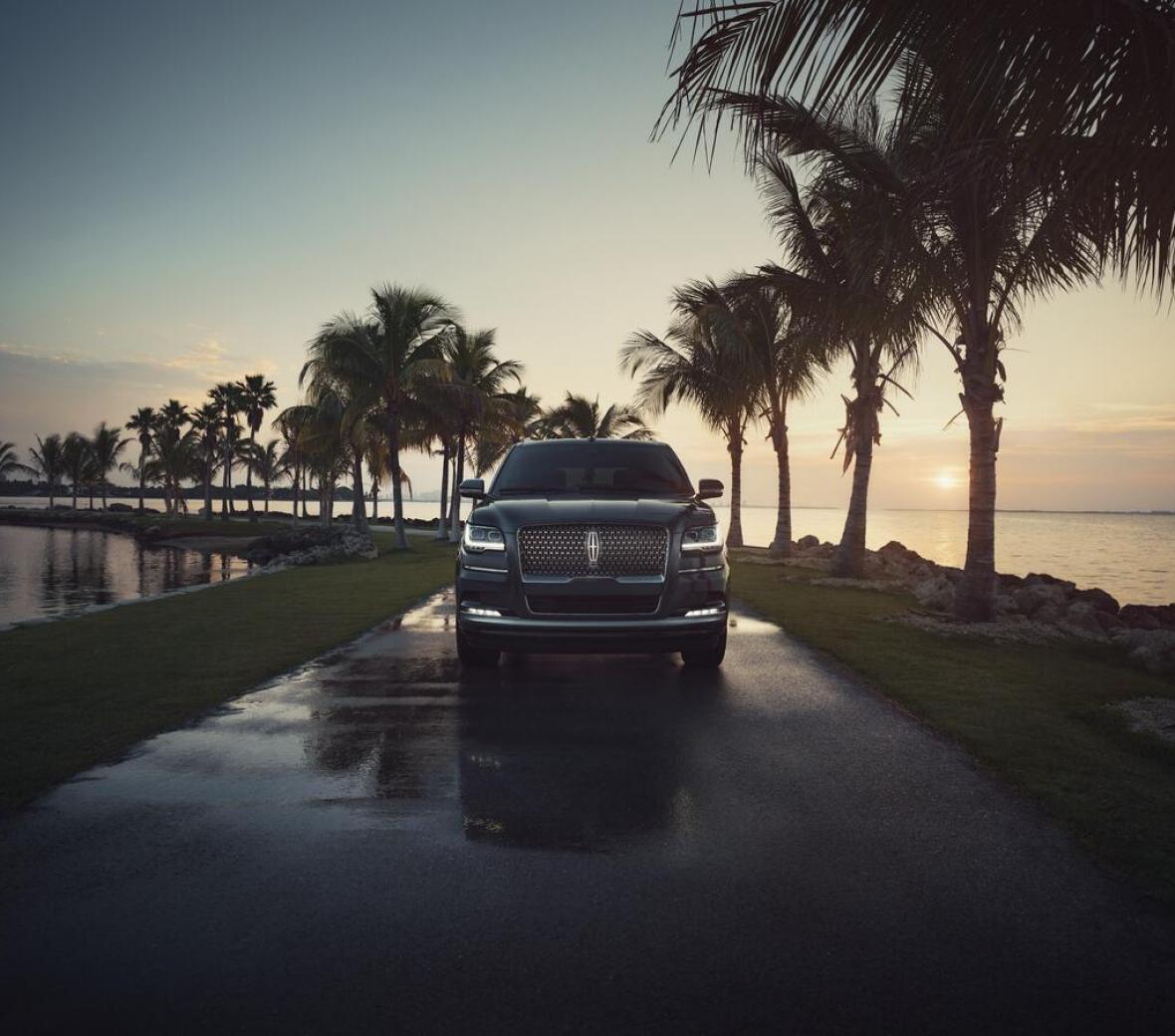 A Black Lincoln SUV on the road