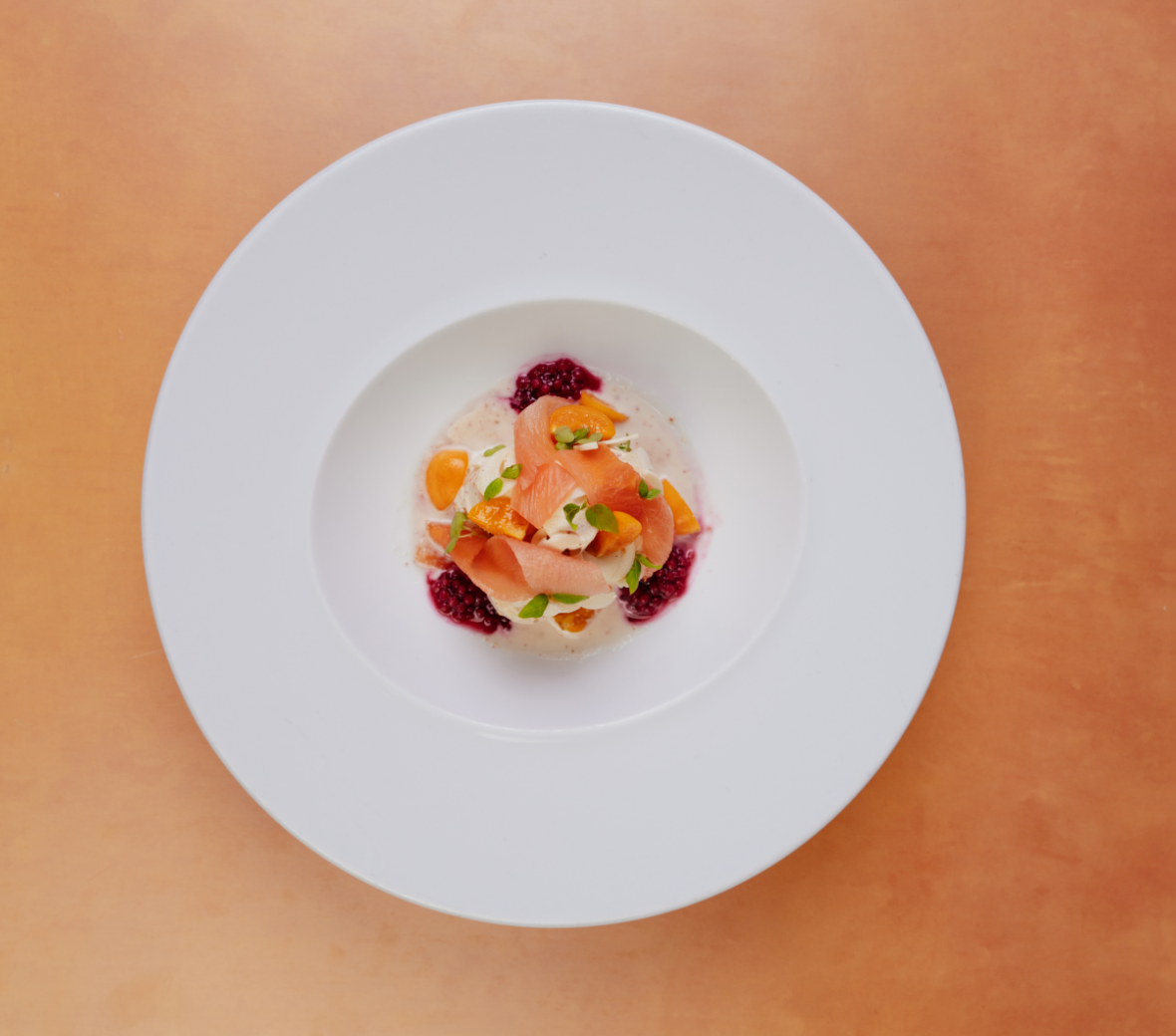 salmon salad with goose berries and a white cream sauce 