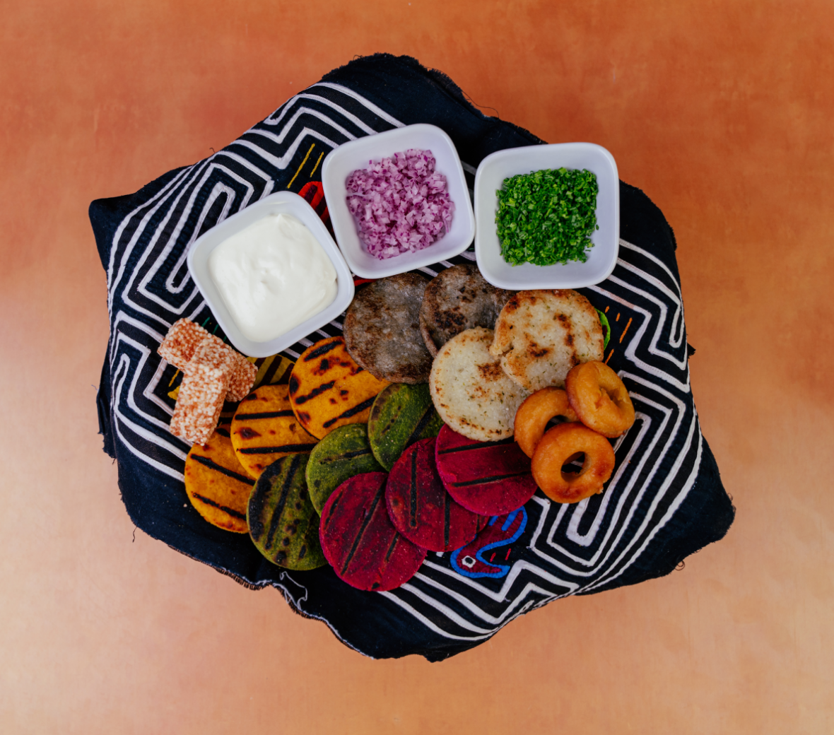 root vegetable cakes and dip and small diced chives and red onion