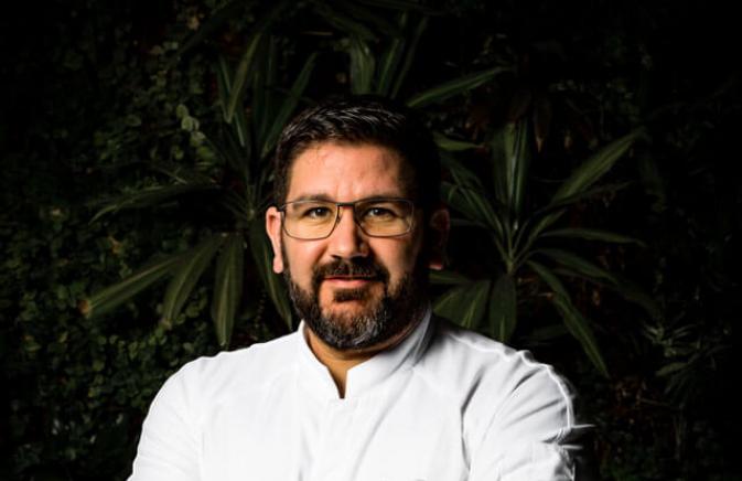 Chef Dani Garcia standing with arms crossed