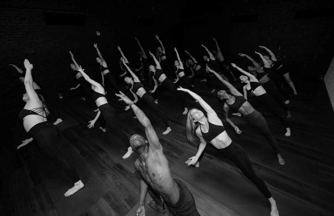 a group of people doing yoga