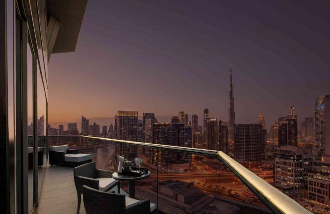 Balcony looking out at Dubai at night.