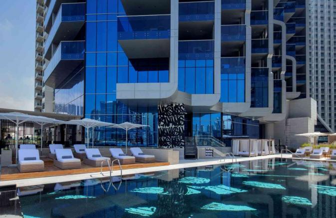 Hyde Hotel Dubai outdoor pool and chairs