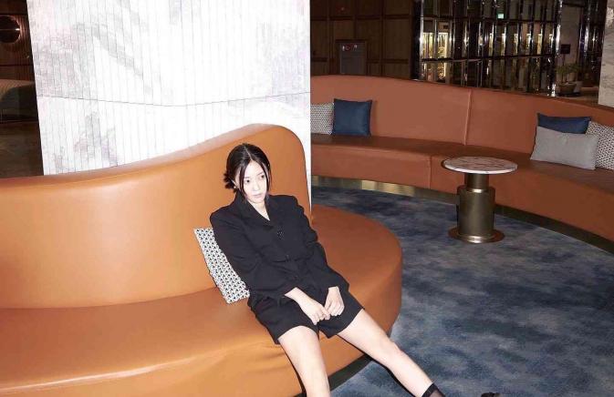 woman sitting in the lobby of Mondrian Seoul