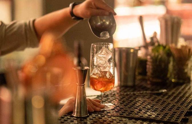 A cocktail being poured 