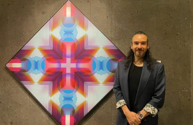 Artist with their geometric painting