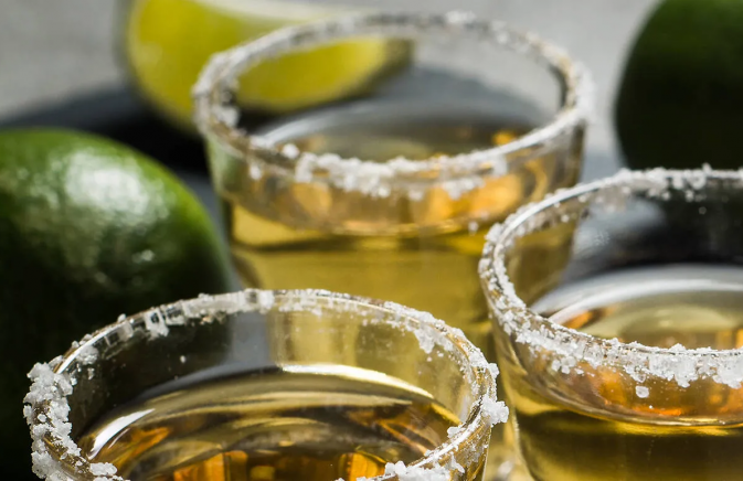 three cocktails and a lime