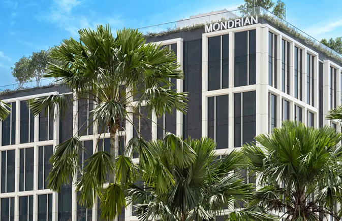 Mondrian Singapore Duxton building nestled amidst lush palm trees, creating a serene and tropical ambiance.