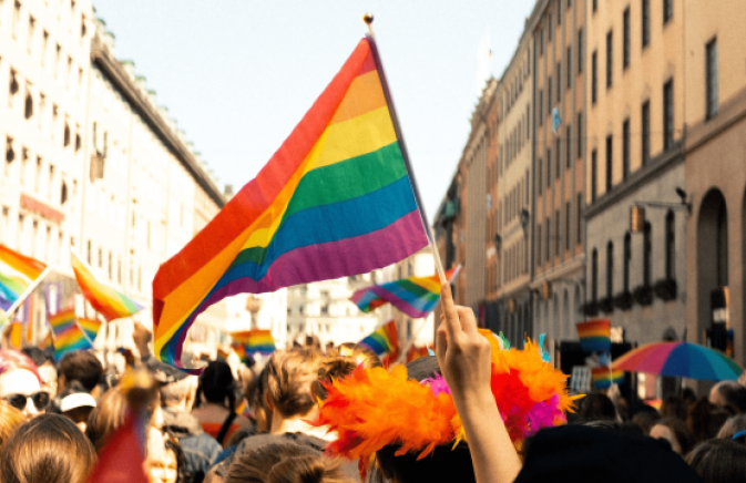 Pride parade with lots of pride flags