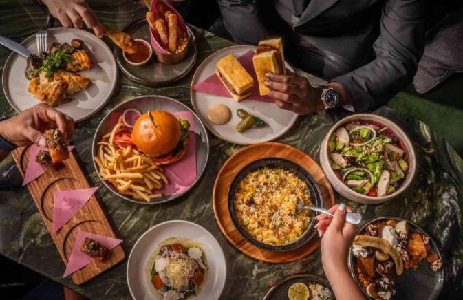 People sharing food over a table 
