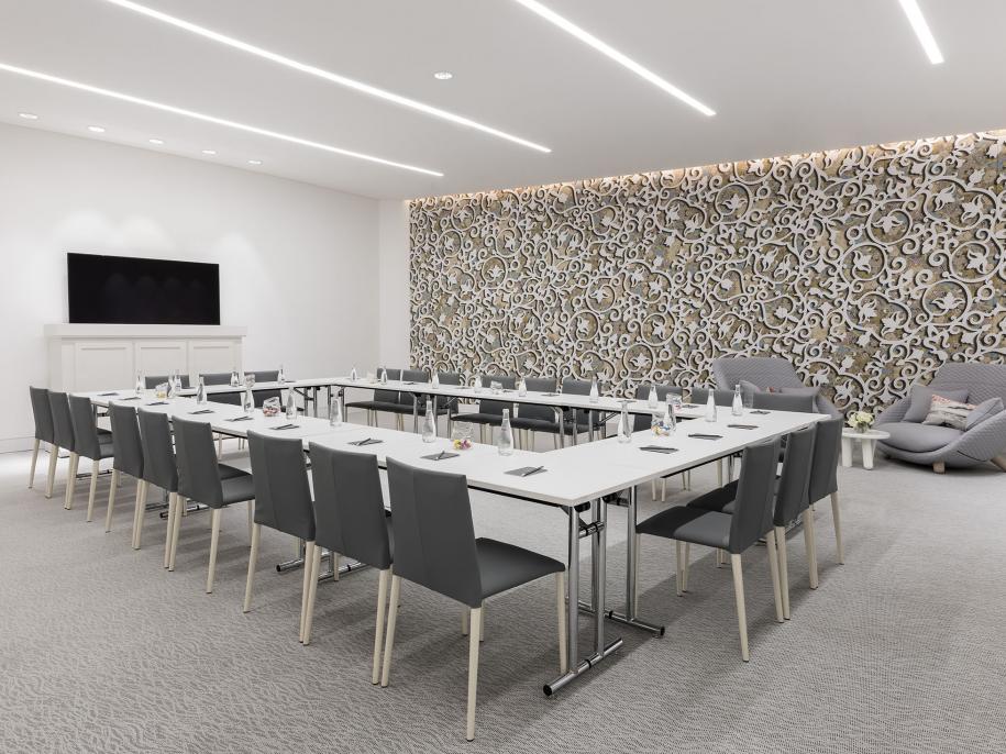 Meeting room set up with tables in a square formation