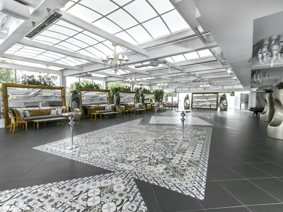 A bright atrium with tiled floor