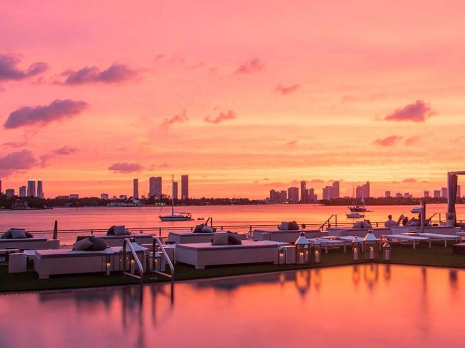 Beach club with sunset behind it