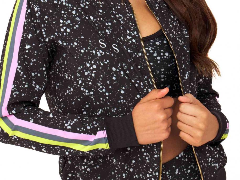 A woman wearing an SLS branded Goldsheep jacket